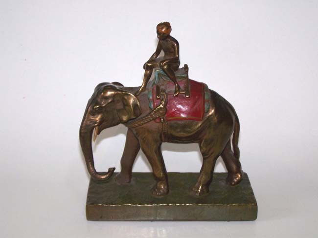 A fine and unusual Pair of Antique Bookends circa 1930 depicting a turbaned man riding an Elephant — image 3